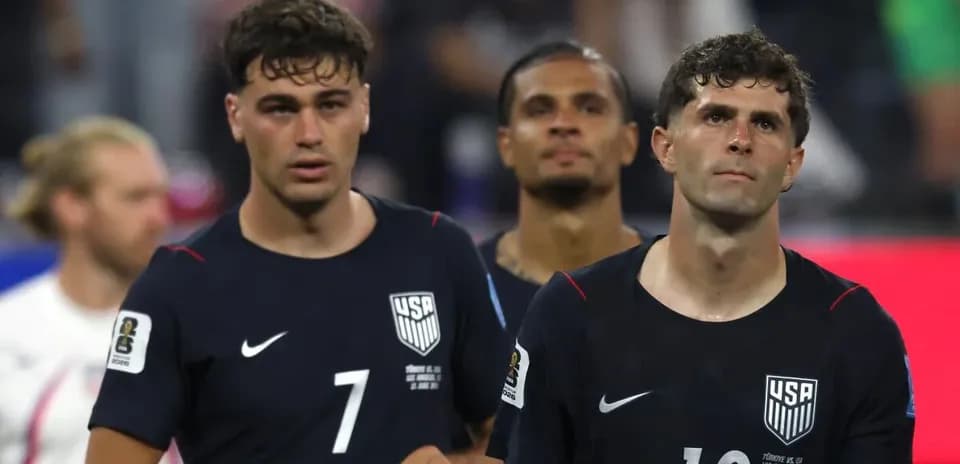 US players walking off the pitch after match