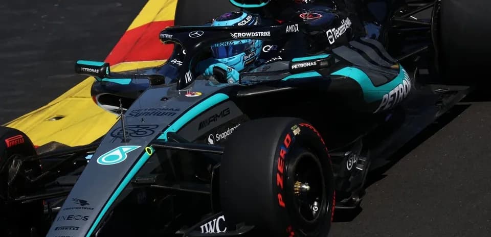 Mercedes Formula 1 car navigating a corner on track