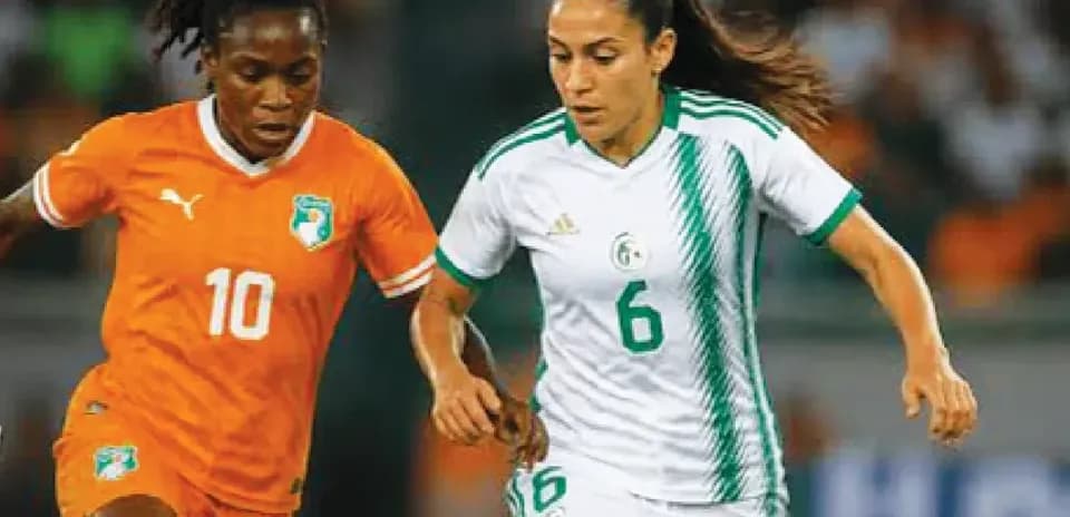 Two players competing for the ball in match