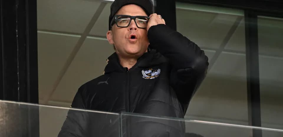 Person in booth shouting during the game