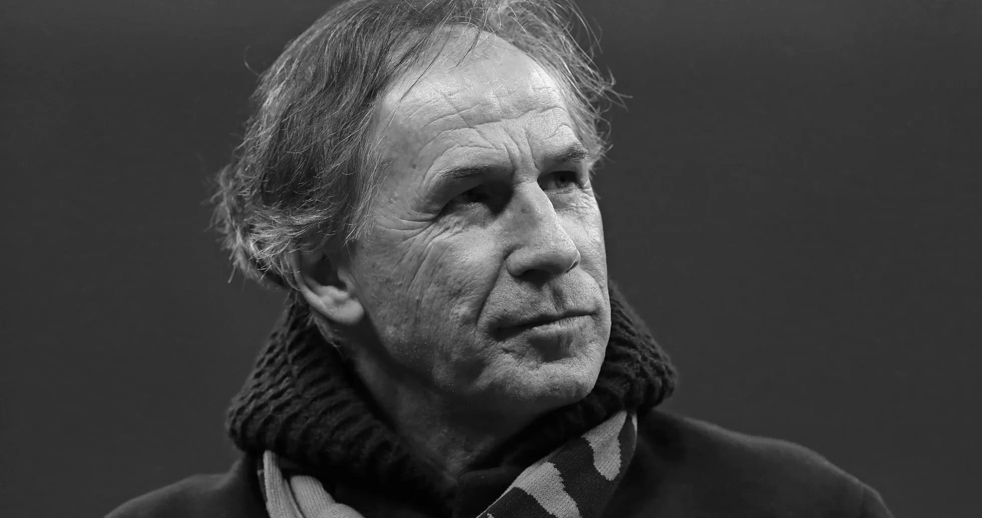 Shirted man with scarf in a thoughtful pose