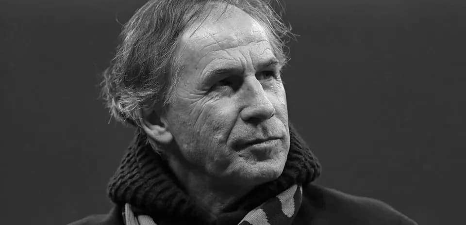 Shirted man with scarf in a thoughtful pose