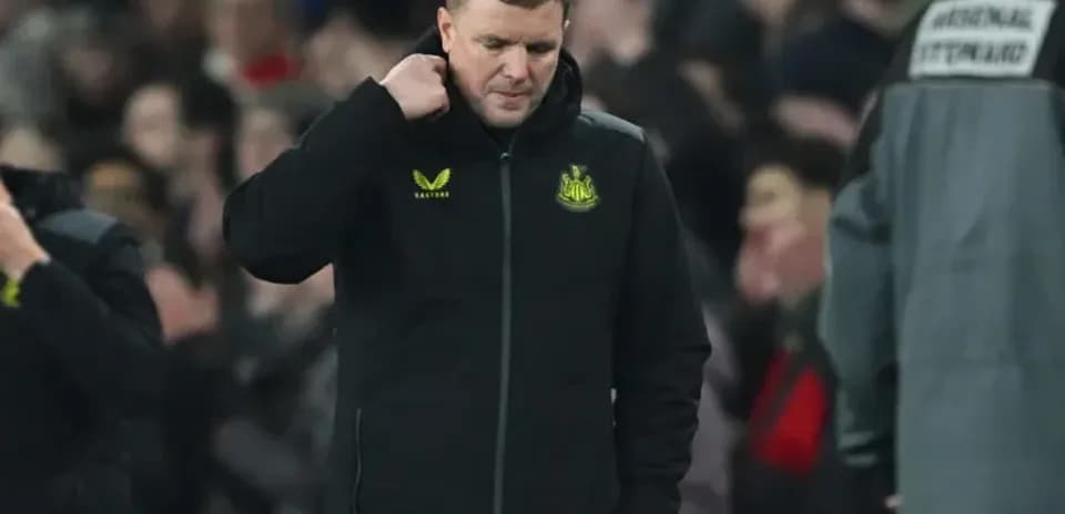 Newcastle United manager walking on the pitch