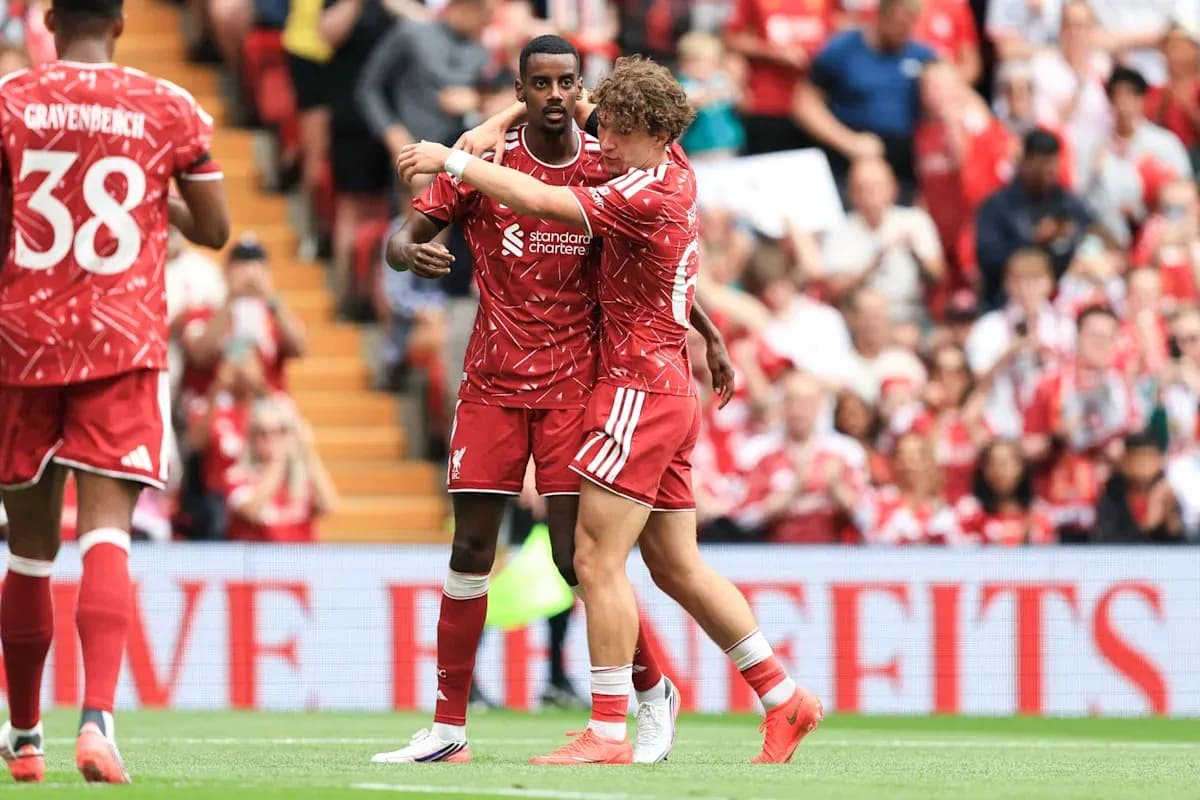 Liverpool players celebrating a goal on the pitch