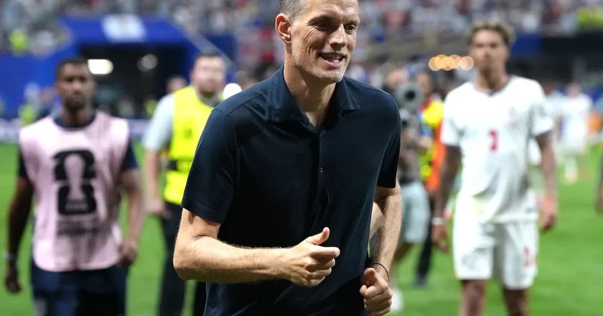 Coach walking on field after the match