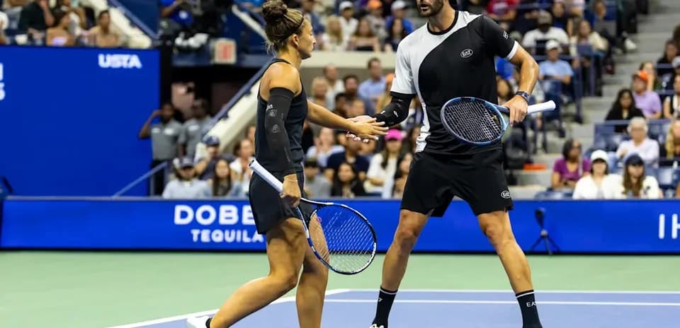 Tennis players shaking hands during match at USTA