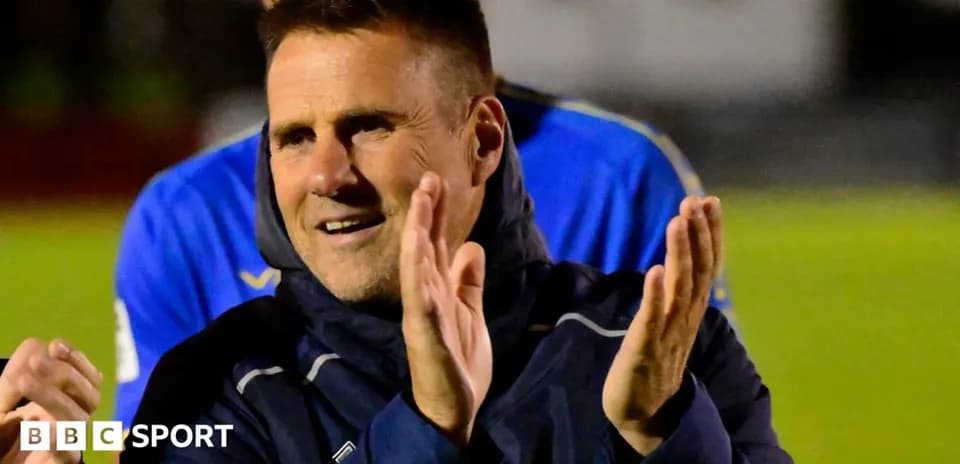 Coach applauding during a match celebration