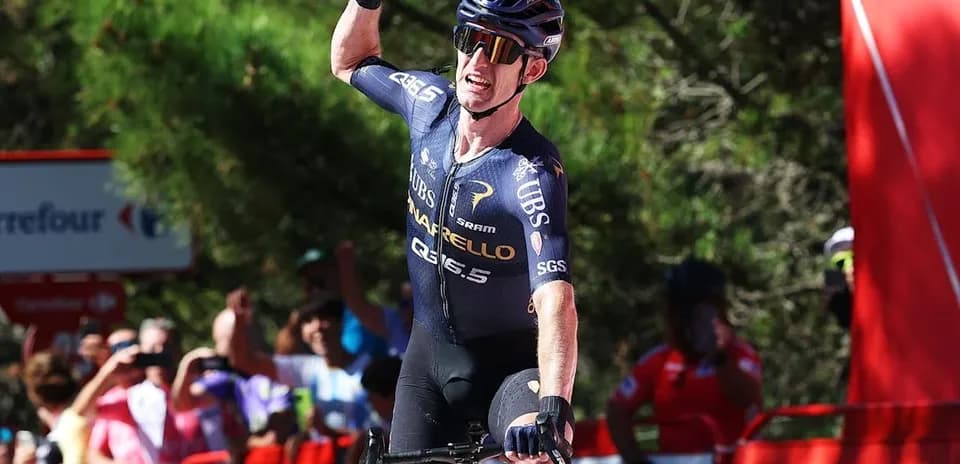Cyclist celebrating victory at race finish line
