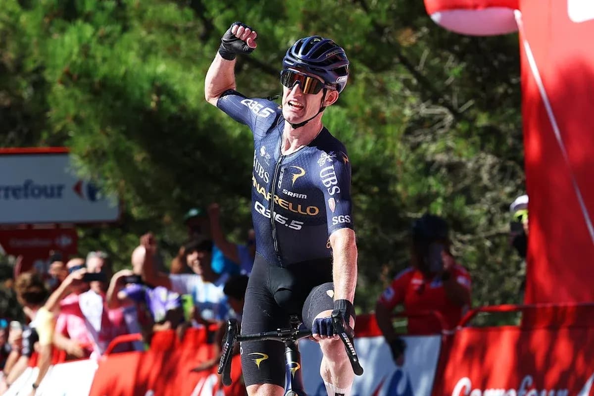 Cyclist celebrating victory at race finish line