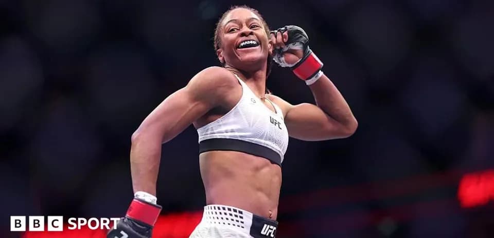 UFC fighter celebrating in the octagon after match