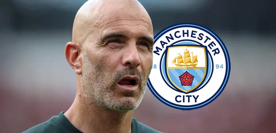 Manchester City coach with club logo in background