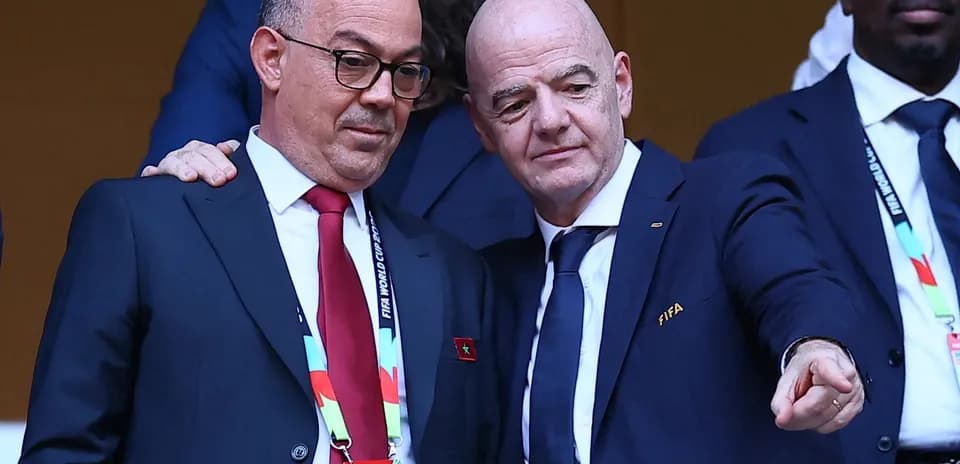 Two officials interacting during a football event