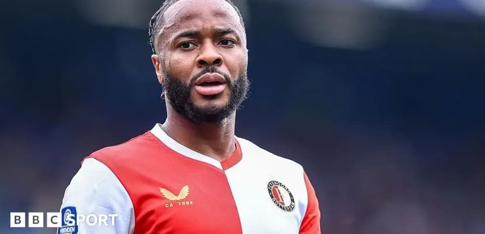 Feyenoord player in red and white jersey on field