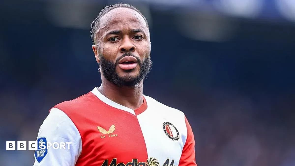 Feyenoord player in red and white jersey on field