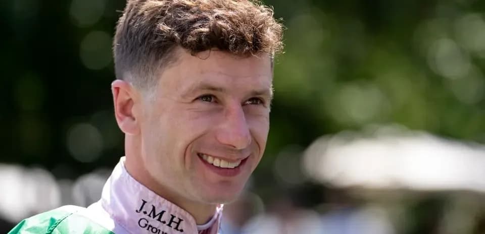Jockey smiling in paddock before race