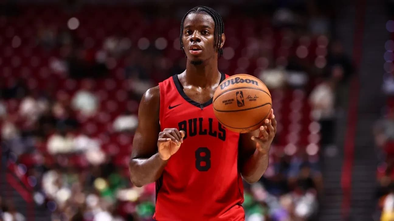 Basketball player holding ball on court