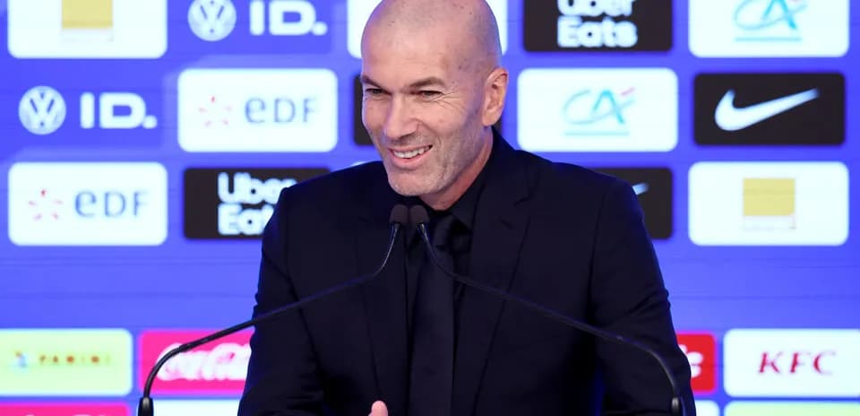Zinedine Zidane speaking at press conference podium