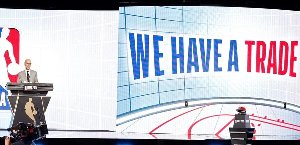 NBA draft event with commissioner announcing trade