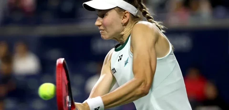 Tennis player hitting a forehand shot on court