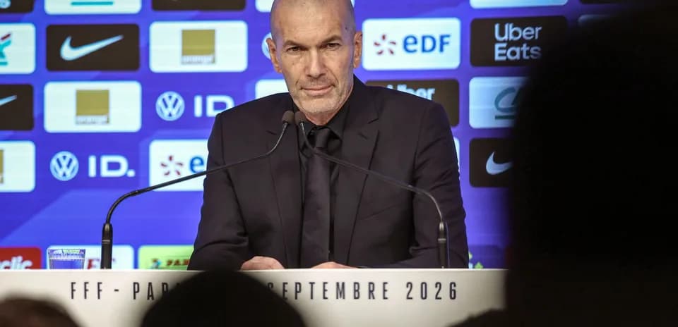 Zinedine Zidane speaking at press conference podium