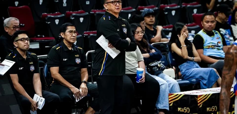Coaches observing the game from the sidelines