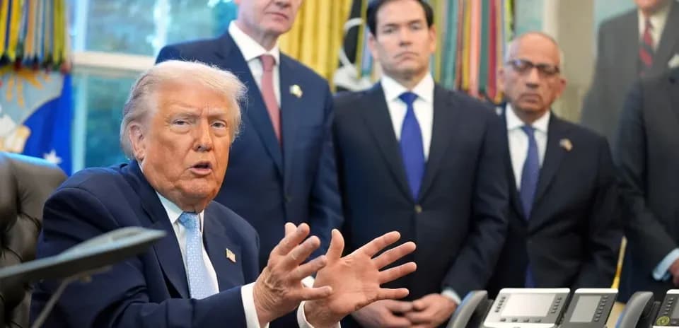 Donald Trump speaking in the Oval Office with officials