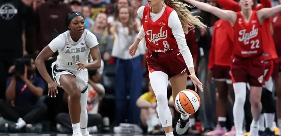 Indy player dribbling ball during basketball game