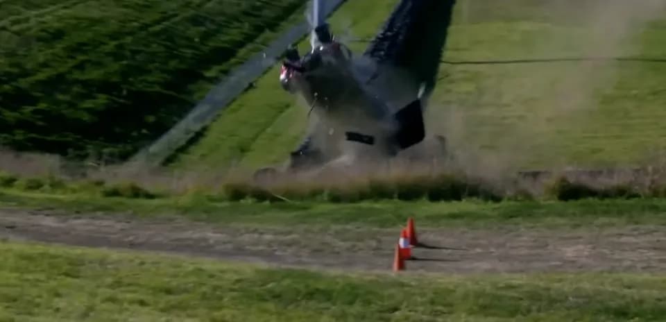 Helicopter crashing on grassy terrain
