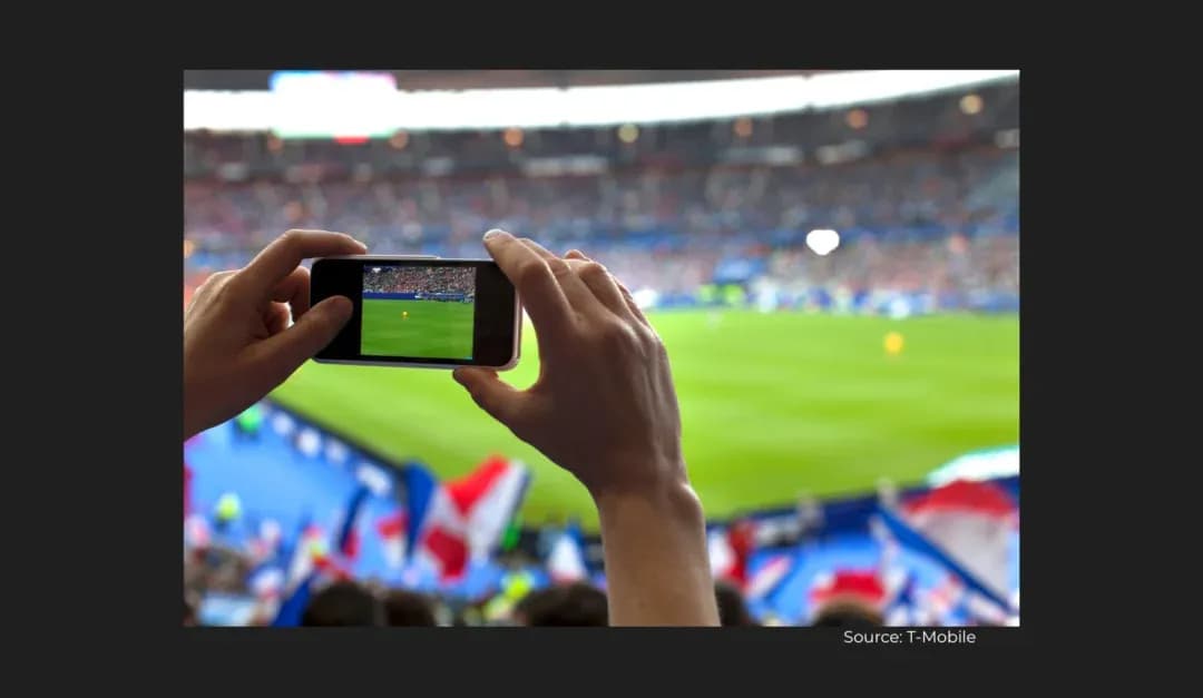 Fan recording a football match with smartphone