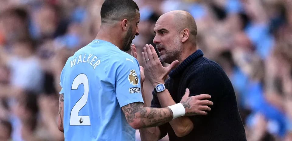 Walker and Guardiola discussing during match