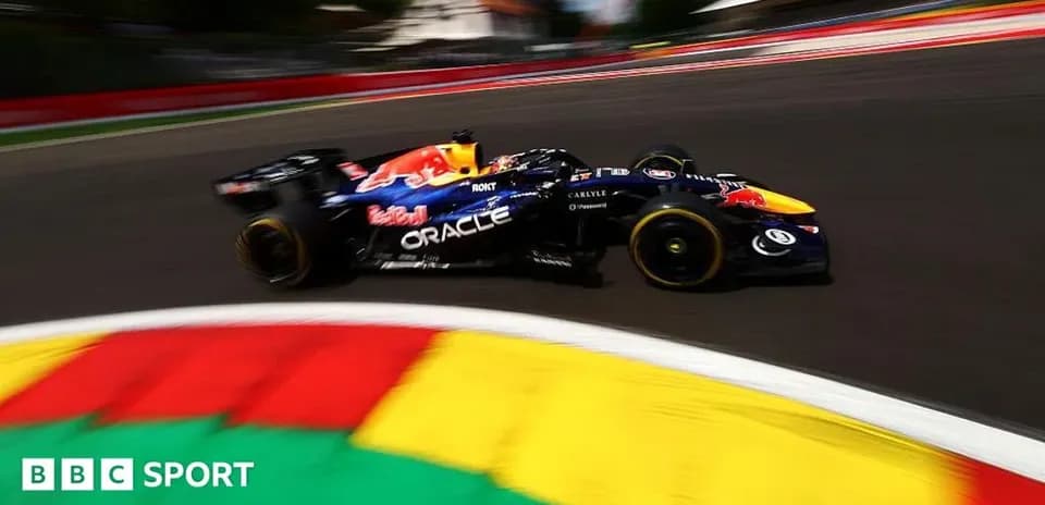 Formula 1 car racing around a corner on track