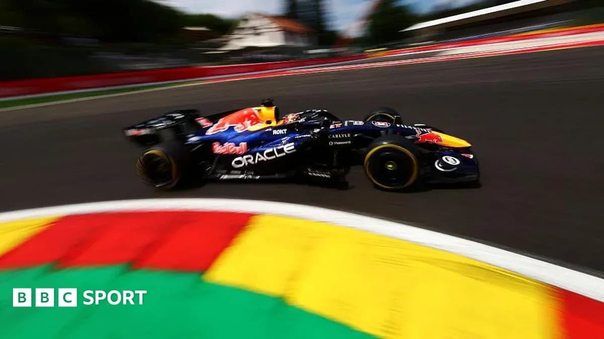 Formula 1 car racing around a corner on track