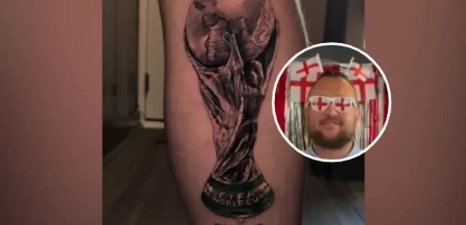 Tatoo of FIFA World Cup trophy on leg