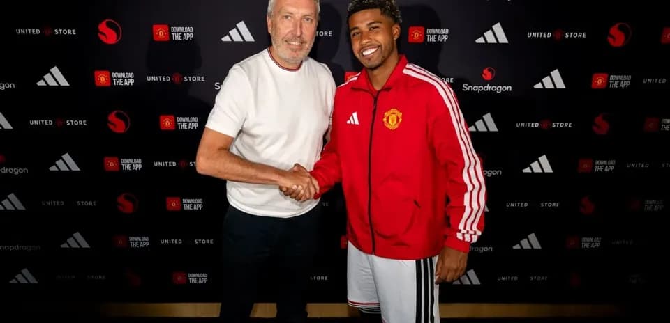 Two men shaking hands at promotional event
