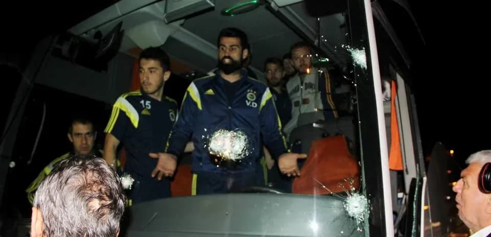 Fenerbahçe players on bus with bullet holes