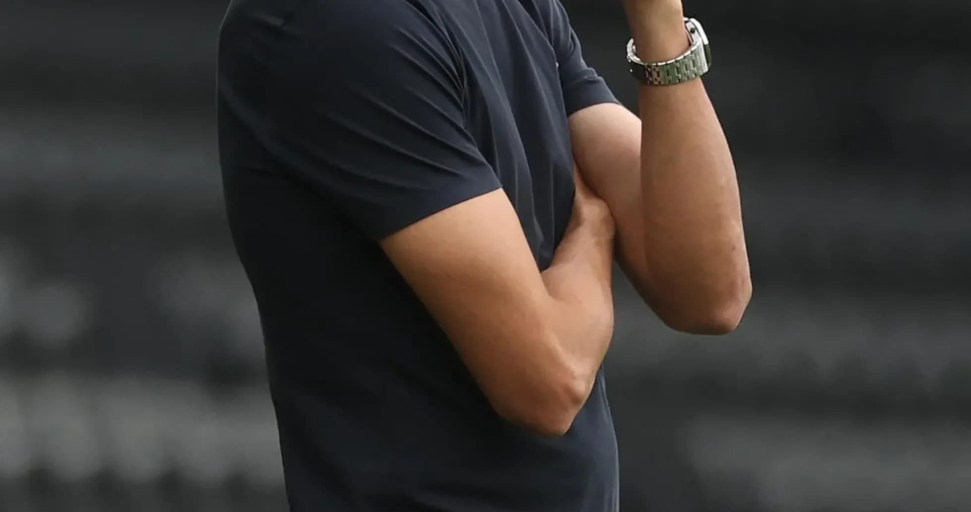 Coach observing the match from the sidelines