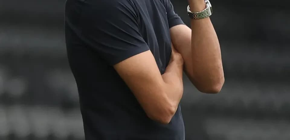 Coach observing the match from the sidelines