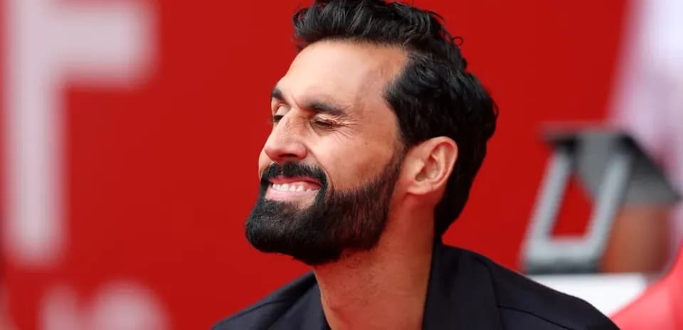 Man smiling while sitting on bench