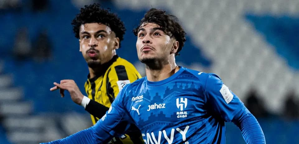 Two football players competing during match action