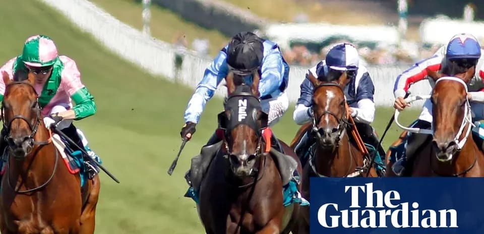 Jockeys racing on horses during a horse race