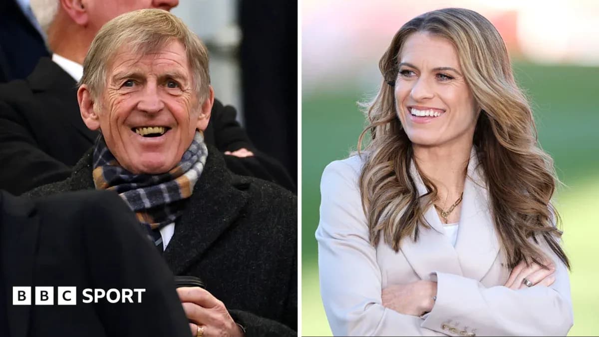 Two sports commentators smiling during event