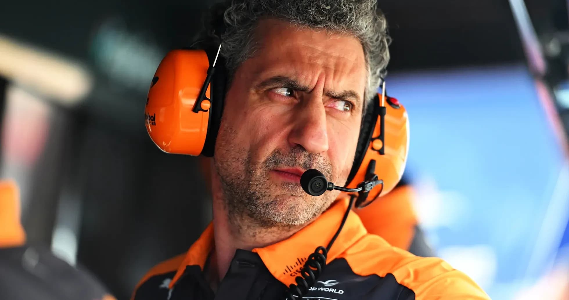 Team principal with headset during racing event