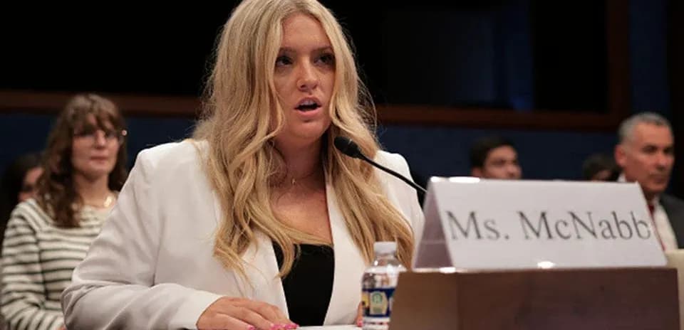 Woman testifying at a congressional hearing