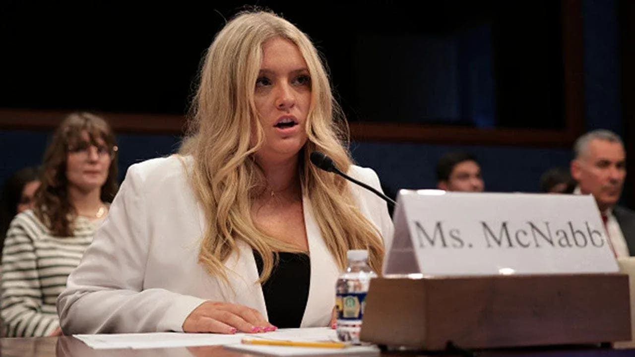 Woman testifying at a congressional hearing