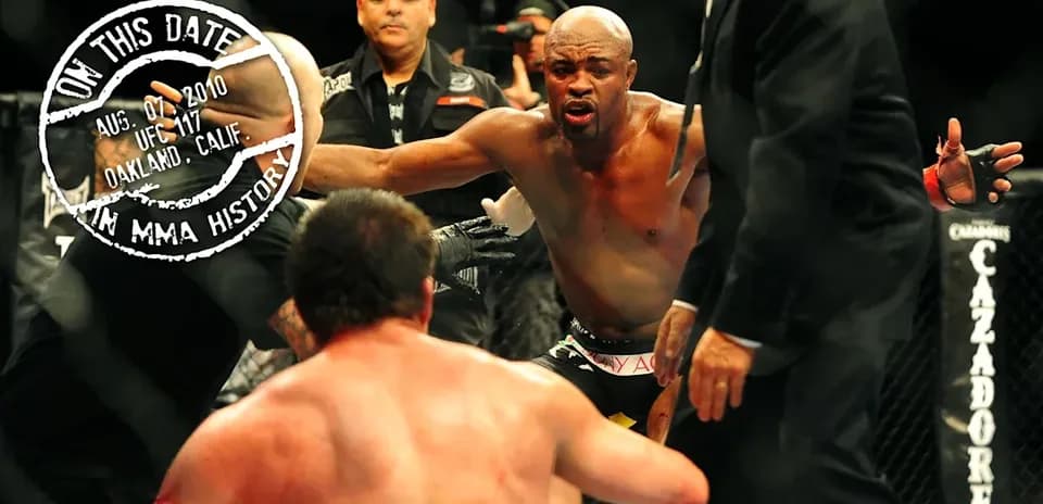 Fighter celebrating victory in the octagon after match