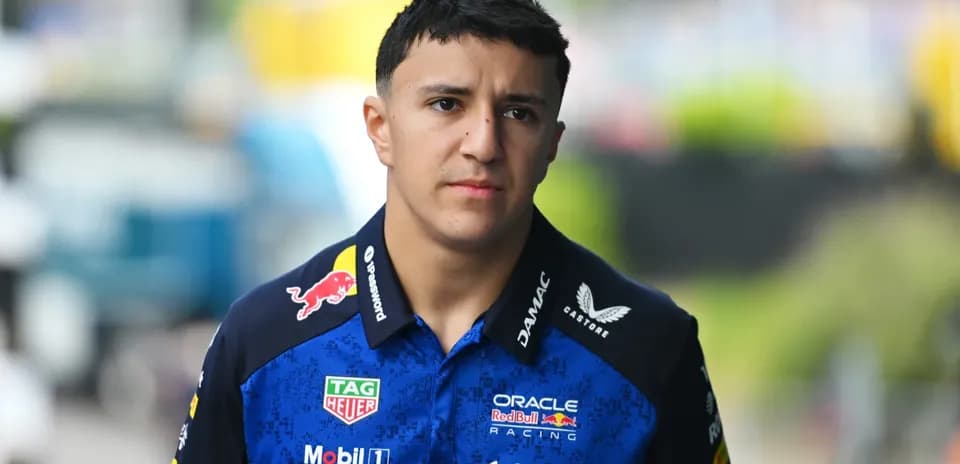 F1 driver walking in team uniform before race
