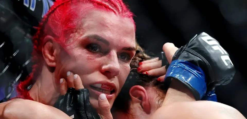 Fighter grappling with opponent during UFC match