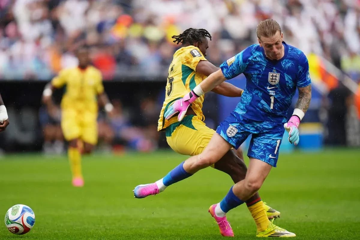 Goalkeeper colliding with opponent during match