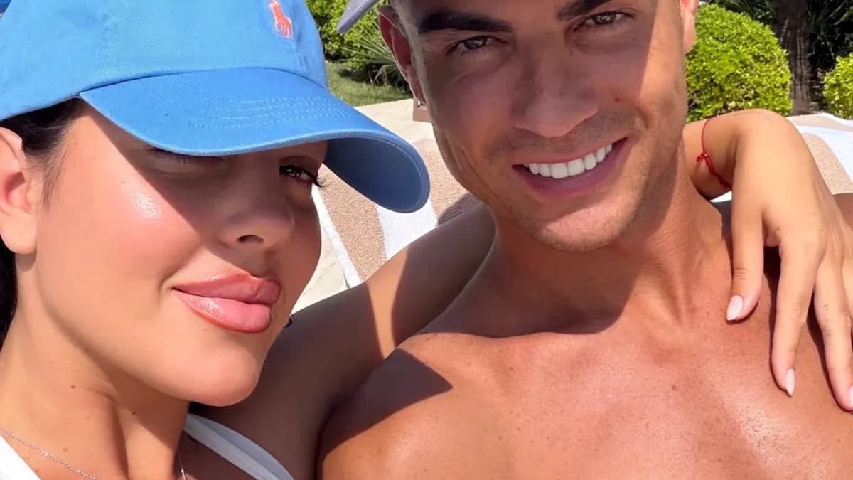 Couple posing for selfie by the pool