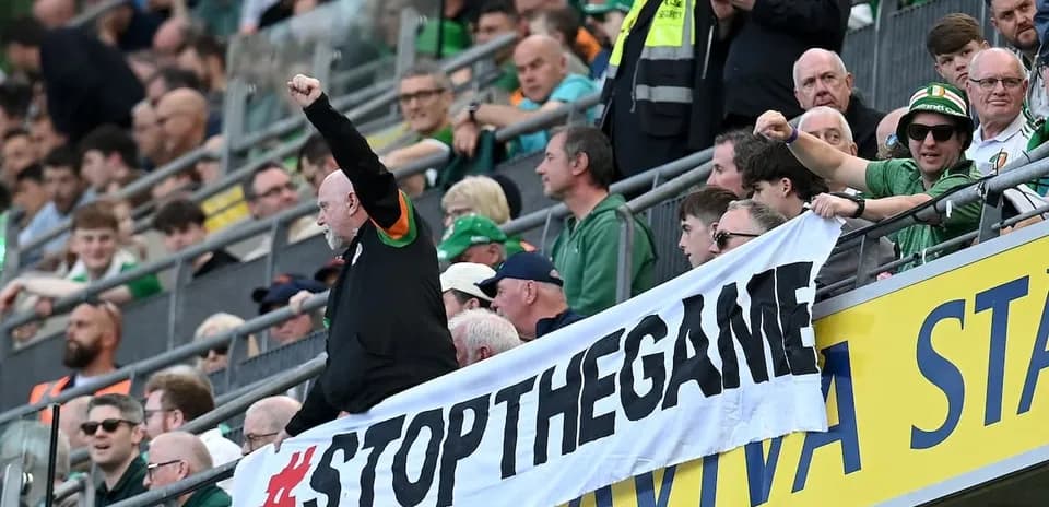 Fans holding a banner during a match